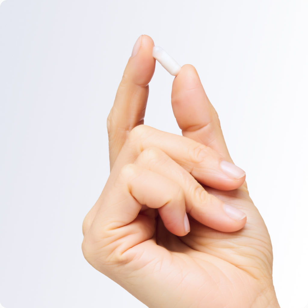 Small capsule in hand